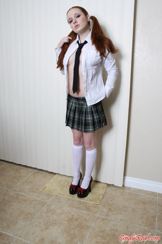 Pictures of teen schoolgirl Cindy Red bending over to show you her pussy