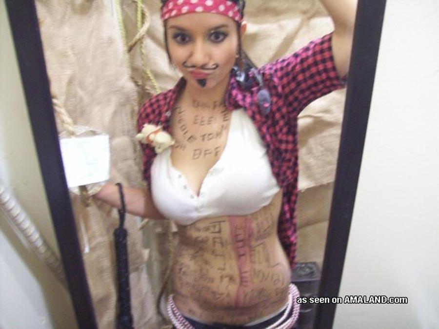 Cute brunette girlfriend self-shooting in pirate costume #60658684
