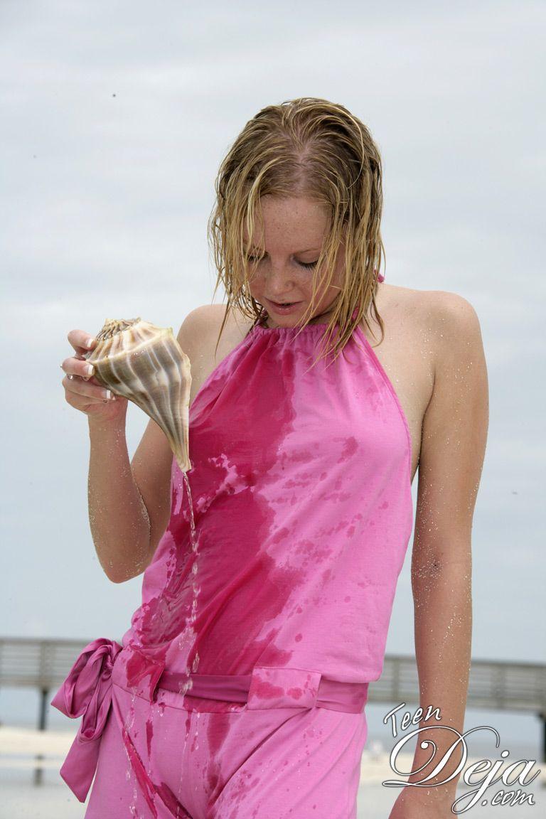 Pictures of Teen Deja getting wet and naked on a beach #60077882