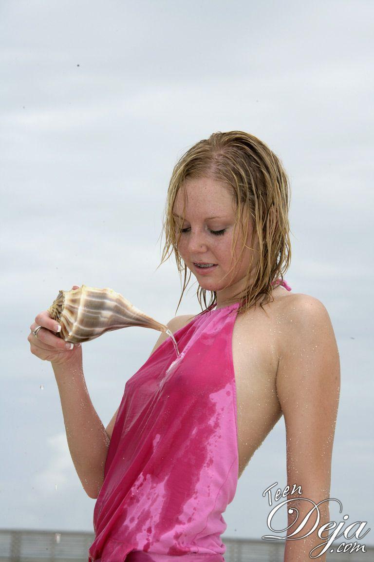 Pictures of Teen Deja getting wet and naked on a beach #60077901