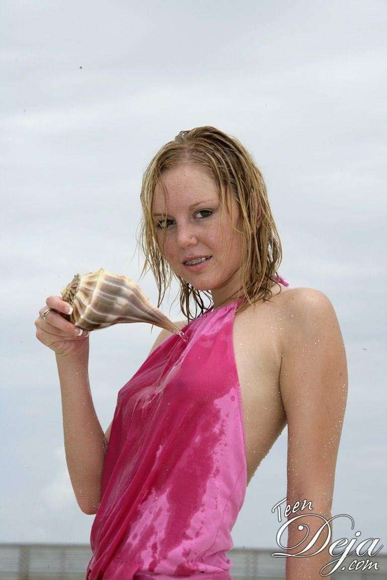 Pictures of Teen Deja getting wet and naked on a beach #60077908