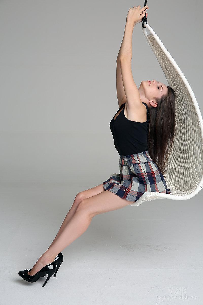 Pretty schoolgirl Serena strips naked on a swing #61945473