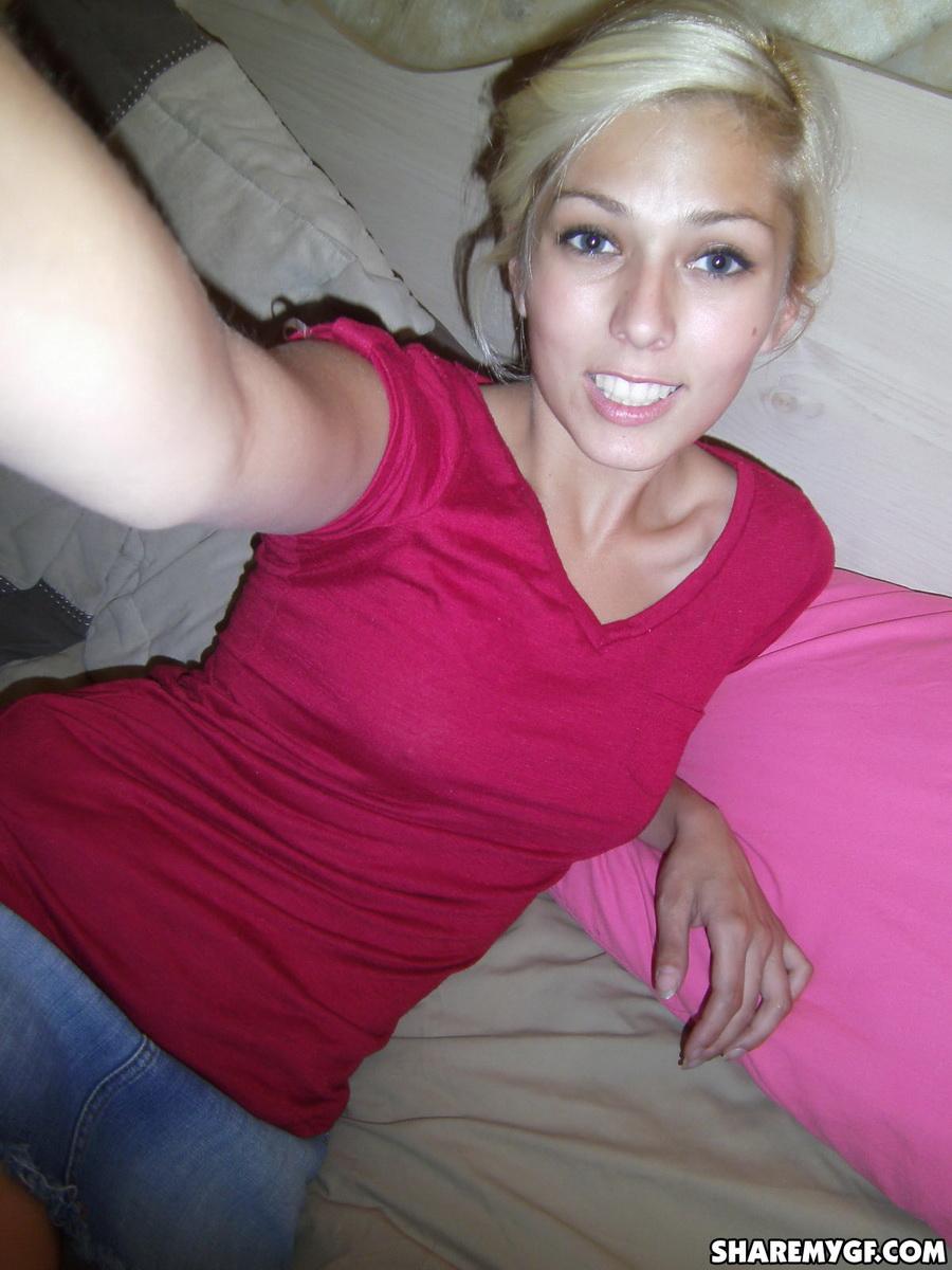 Cute blonde takes selfshot pictures of her perky tits and tight pussy #60792379