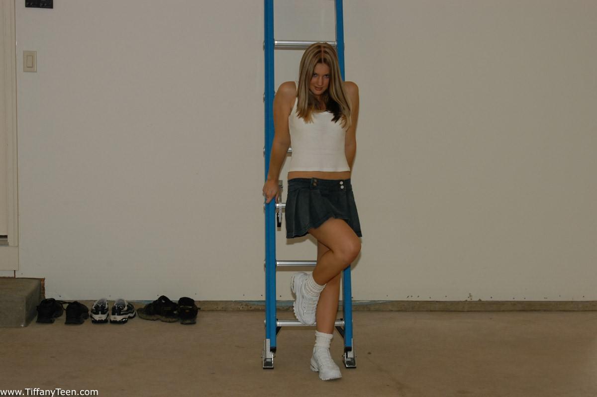 Tiffany Teen plays on a ladder #60098552
