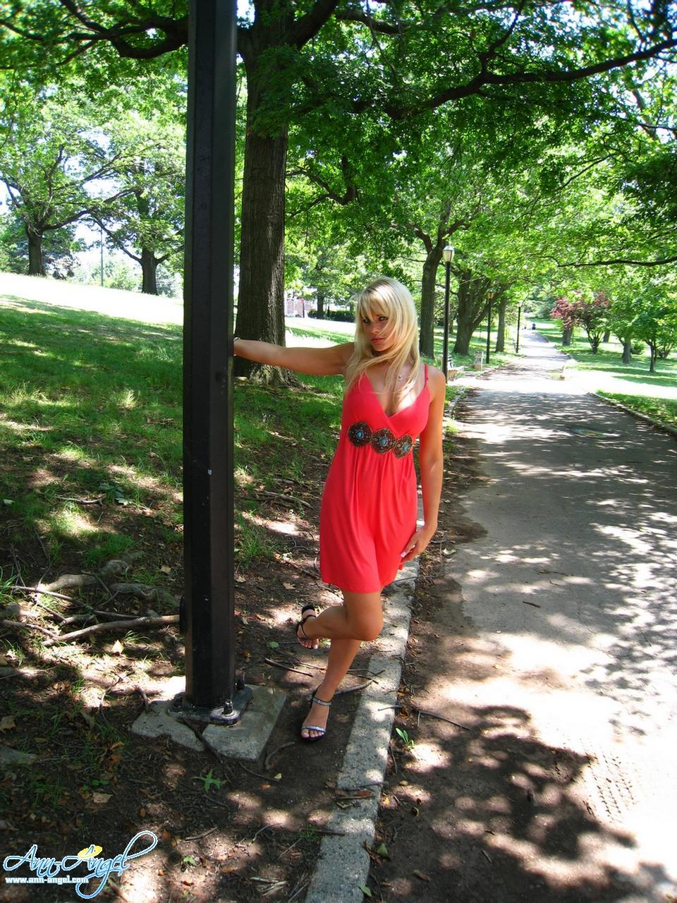 Pictures of Ann Angel teasing in a red dress at the park #53219032