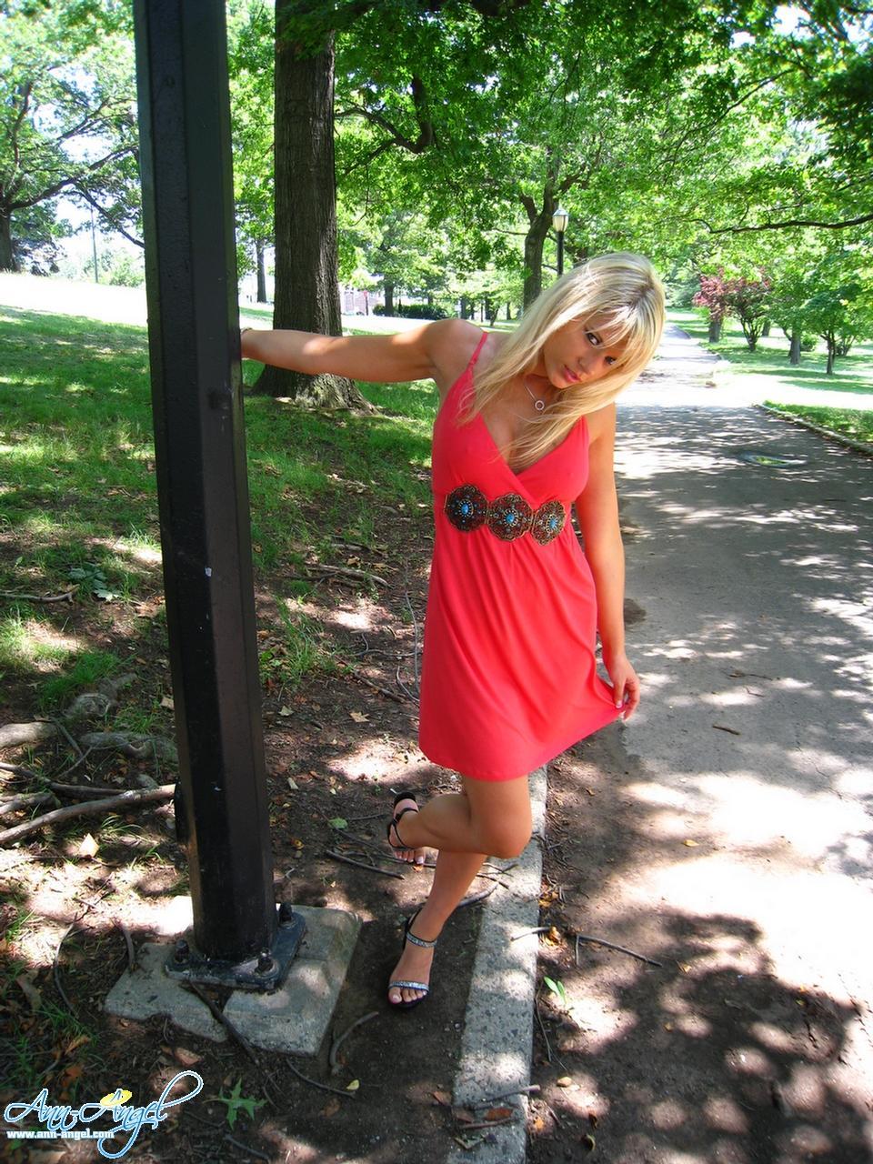 Pictures of Ann Angel teasing in a red dress at the park #53219064