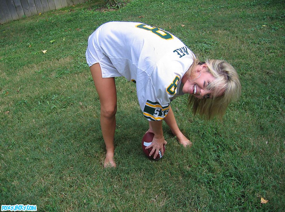 Pictures of teen babe Foxy Jacky playing football in the back yard #54398637