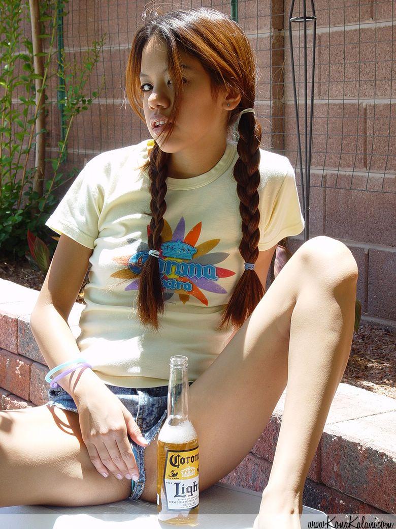 Pictures of teen Kona Kalani teasing in pigtails and short shorts #58767392