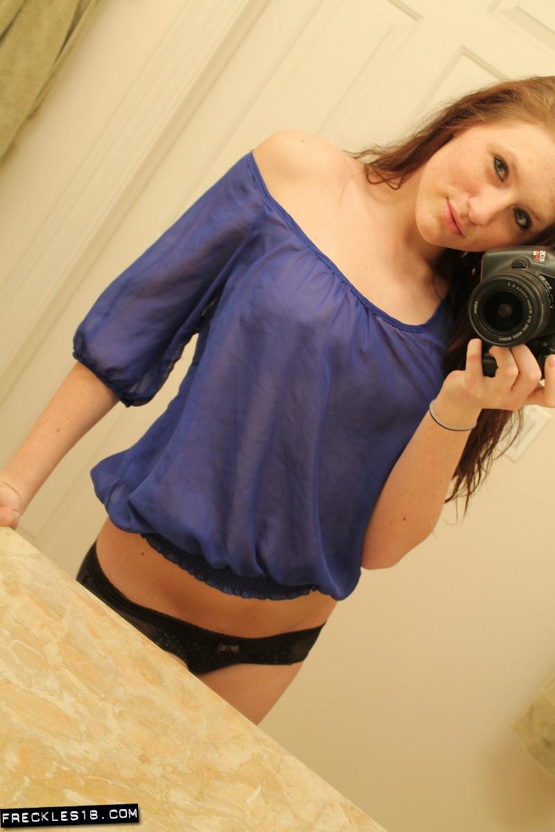 Freckles 18 takes prankish pics of herself in a sheer blue top