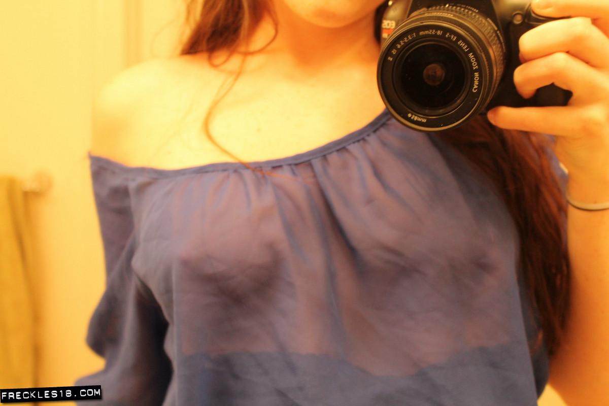 Freckles 18 takes naughty pics of herself in a sheer blue top #54414406