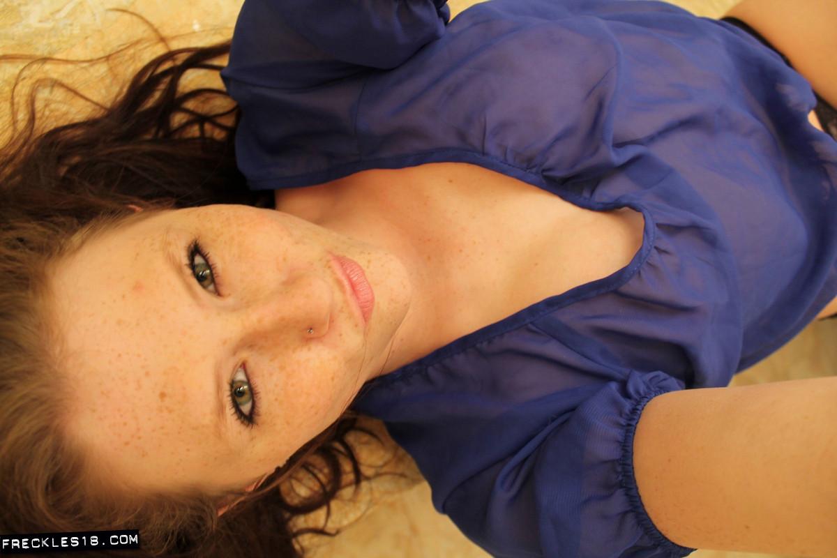 Freckles 18 takes naughty pics of herself in a sheer blue top #54414500