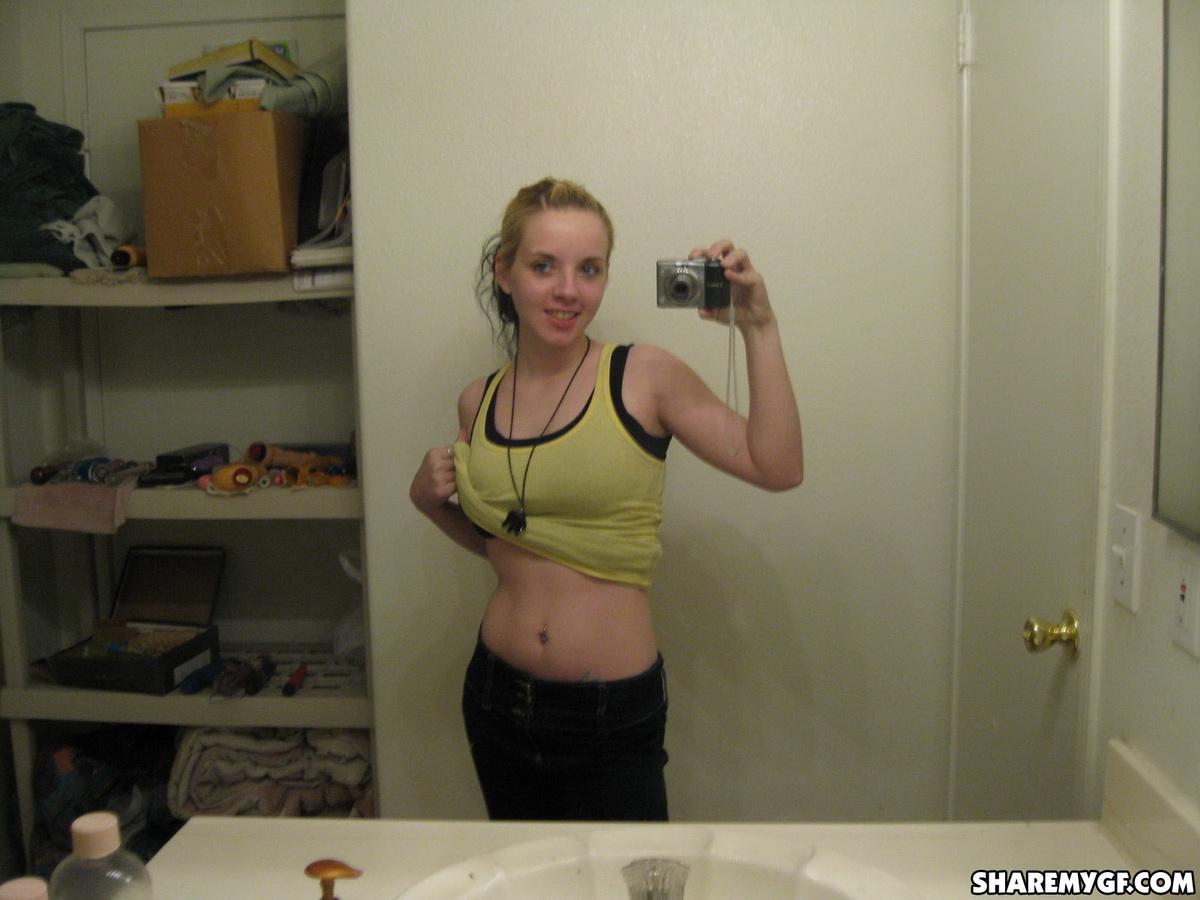 Cute Blonde Gets Naked And Takes Selfshot Mirror Pictures Of Her Pierced Nipples