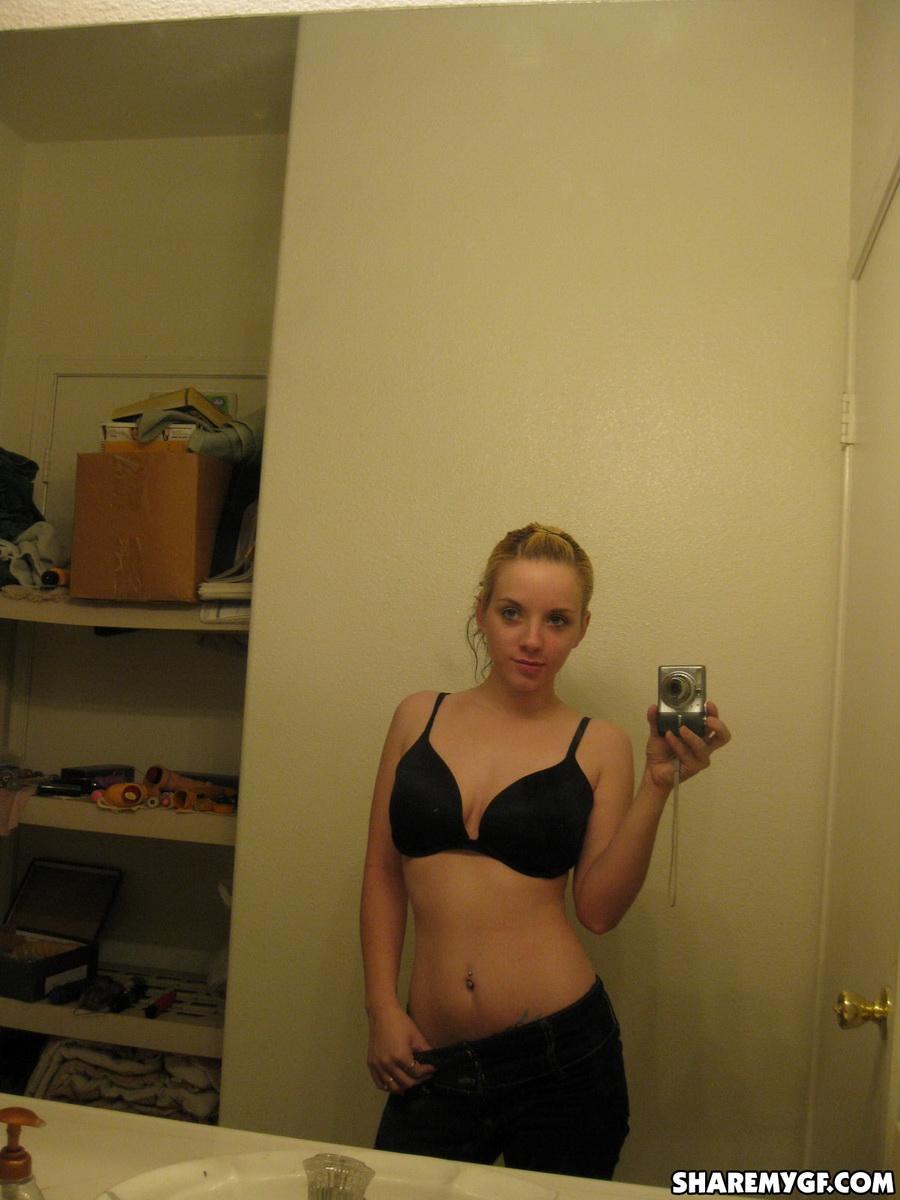 Cute blonde gets naked and takes selfshot mirror pictures of her pierced nipples #60791270