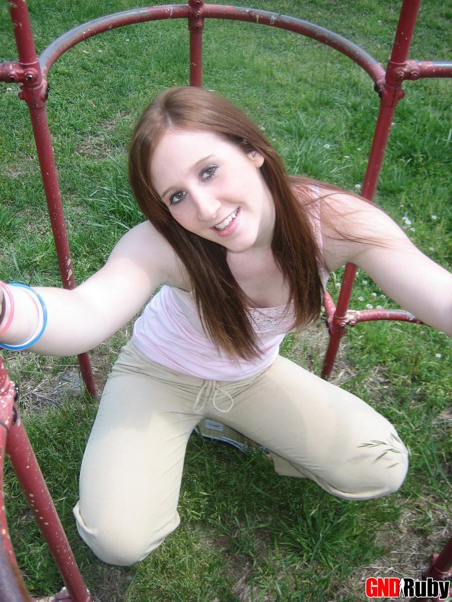 Cute ginger teen Ruby flashes her perky tits at the park while playing on the jungle gym #59948663