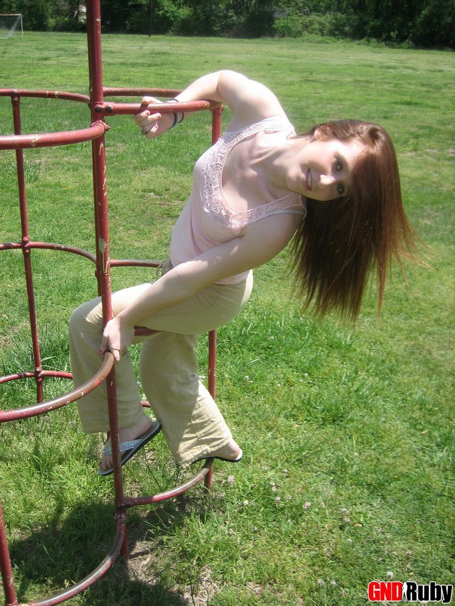 Cute ginger teen Ruby flashes her perky tits at the park while playing on the jungle gym #59948701