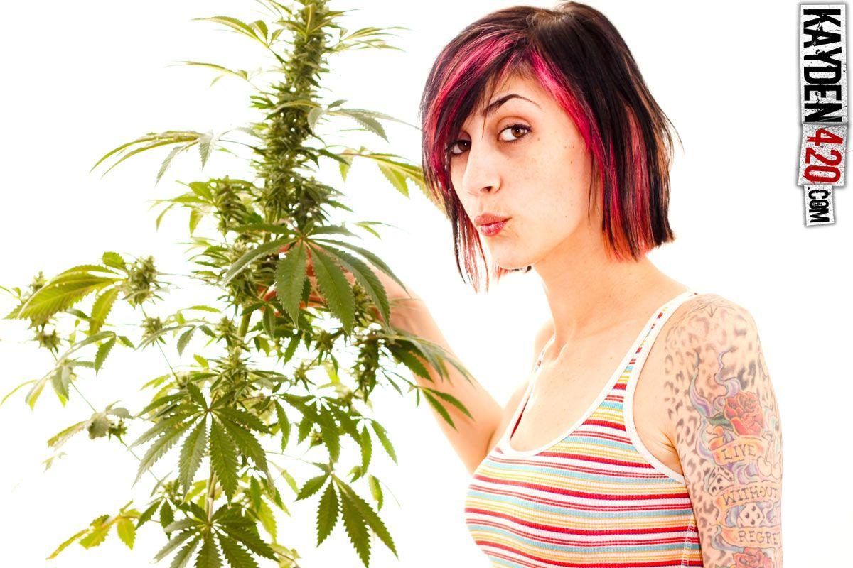 Pictures of Kayden 420 tending to her plants