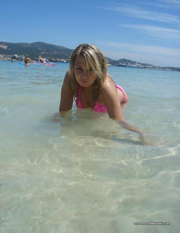 Sexy blonde bikini beach babe posing outdoors #60918103
