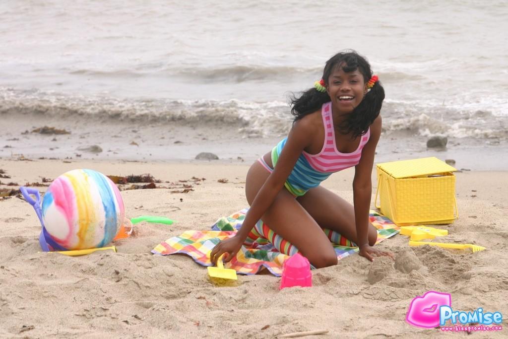 Pictures of ebony teen Kiss Promise flashing on a beach #58757983