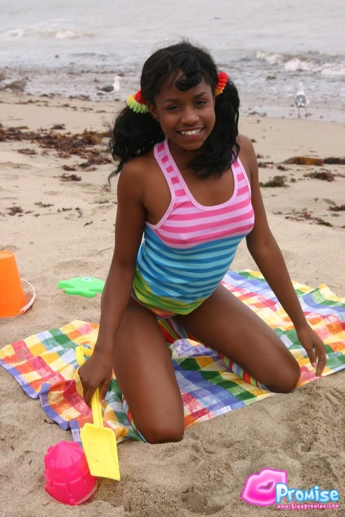 Pictures of ebony teen Kiss Promise flashing on a beach #58758009