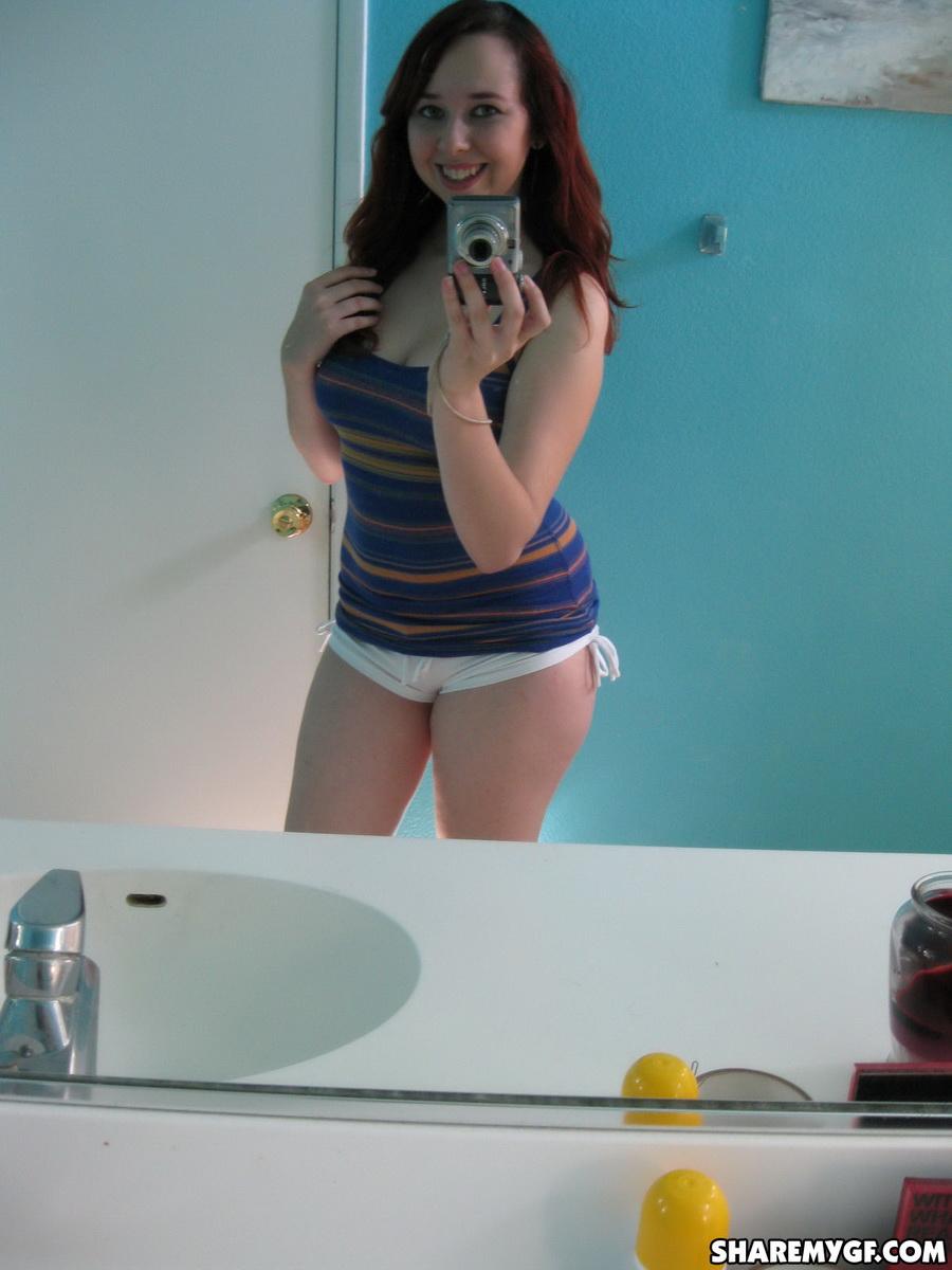 Chubby curvy girlfriend takes selfshot mirror pictures for her boyfriend as she strips picture
