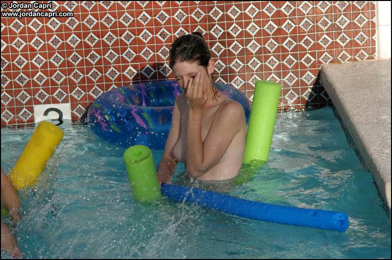 Lesbians teens play in a pool #55634369