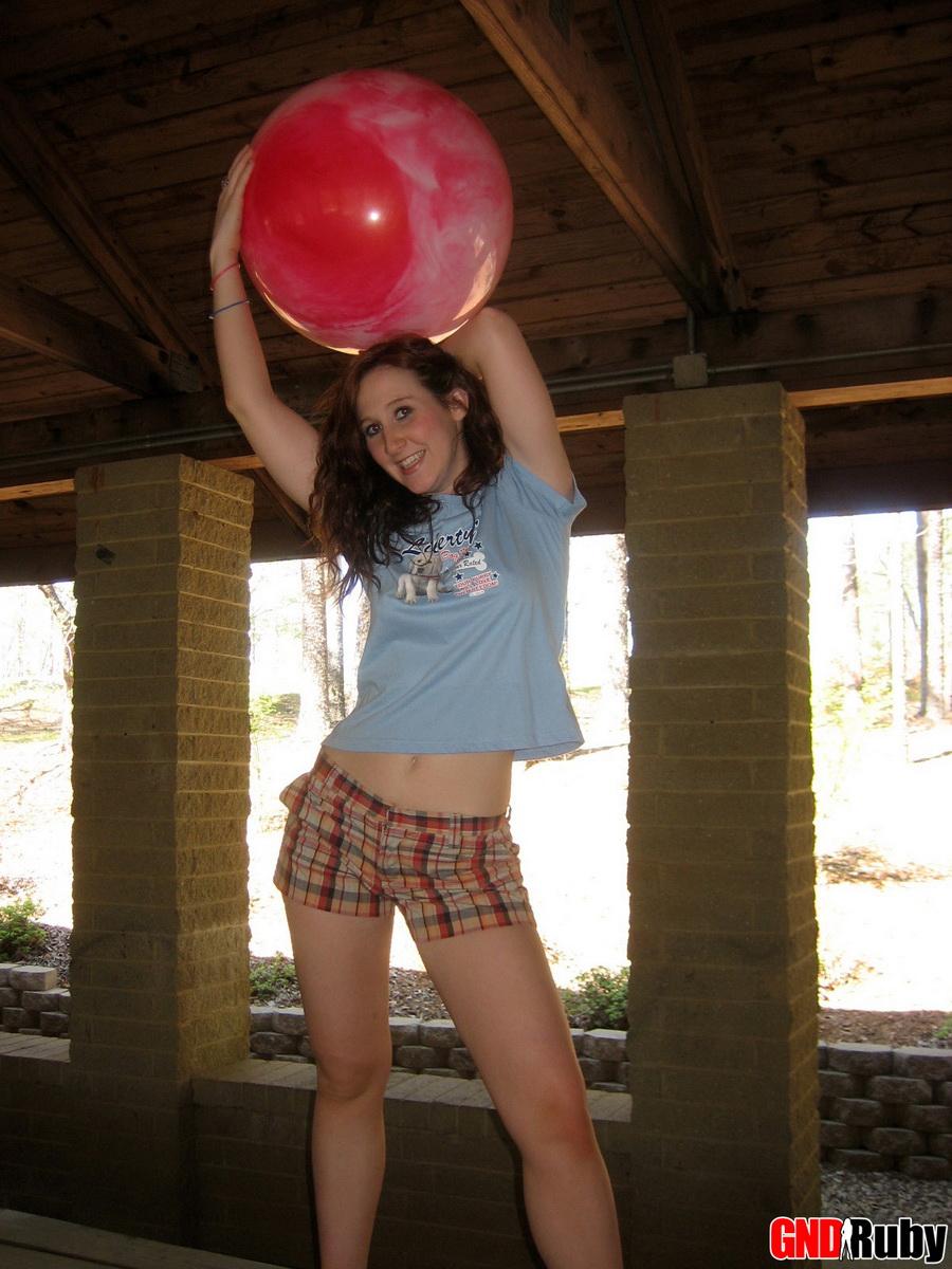 Ginger teen Ruby flashes her perky tits at the park while playing with a pink ball #59948265
