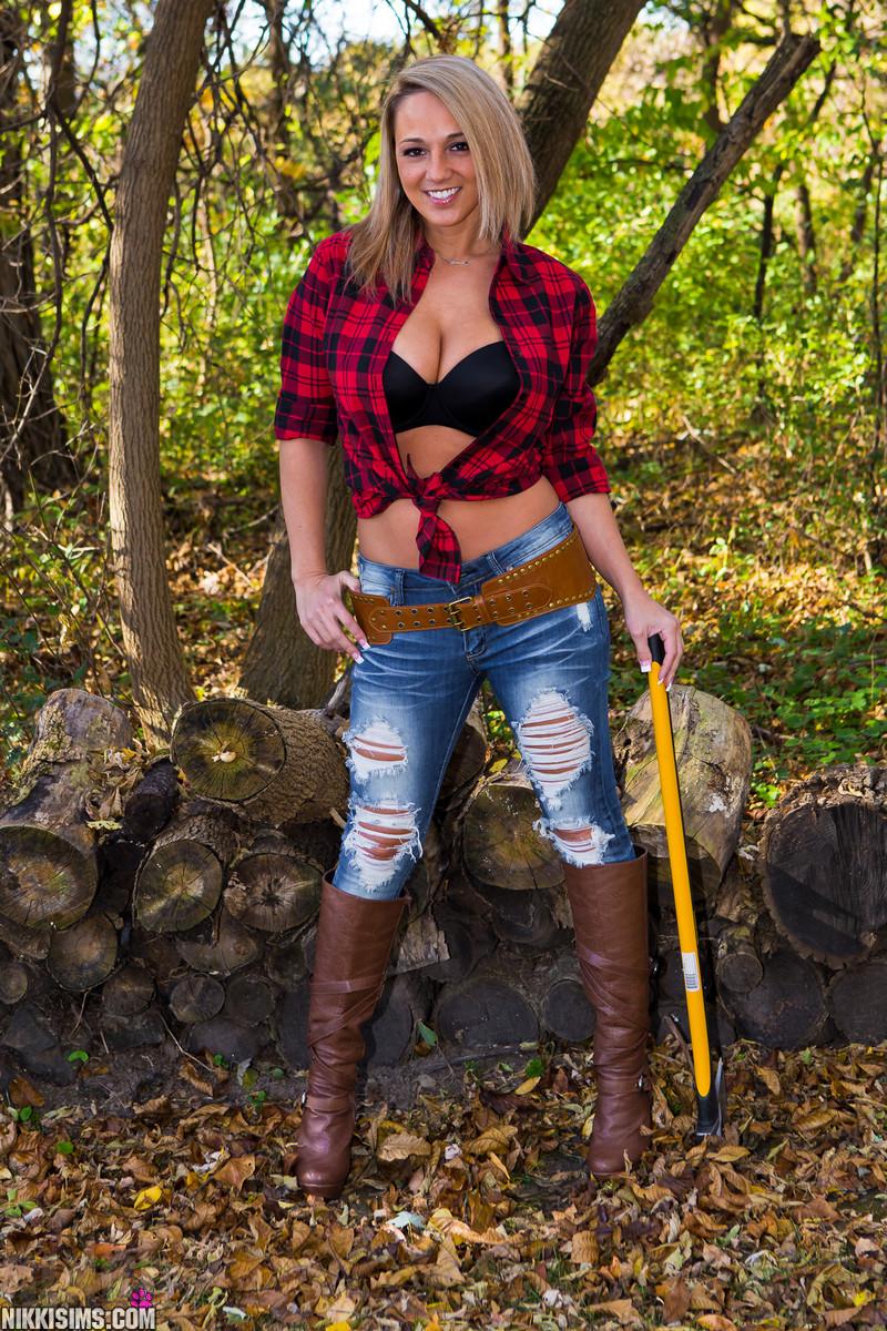 Beautiful girl Nikki Sims teases as a sexy lumberjack