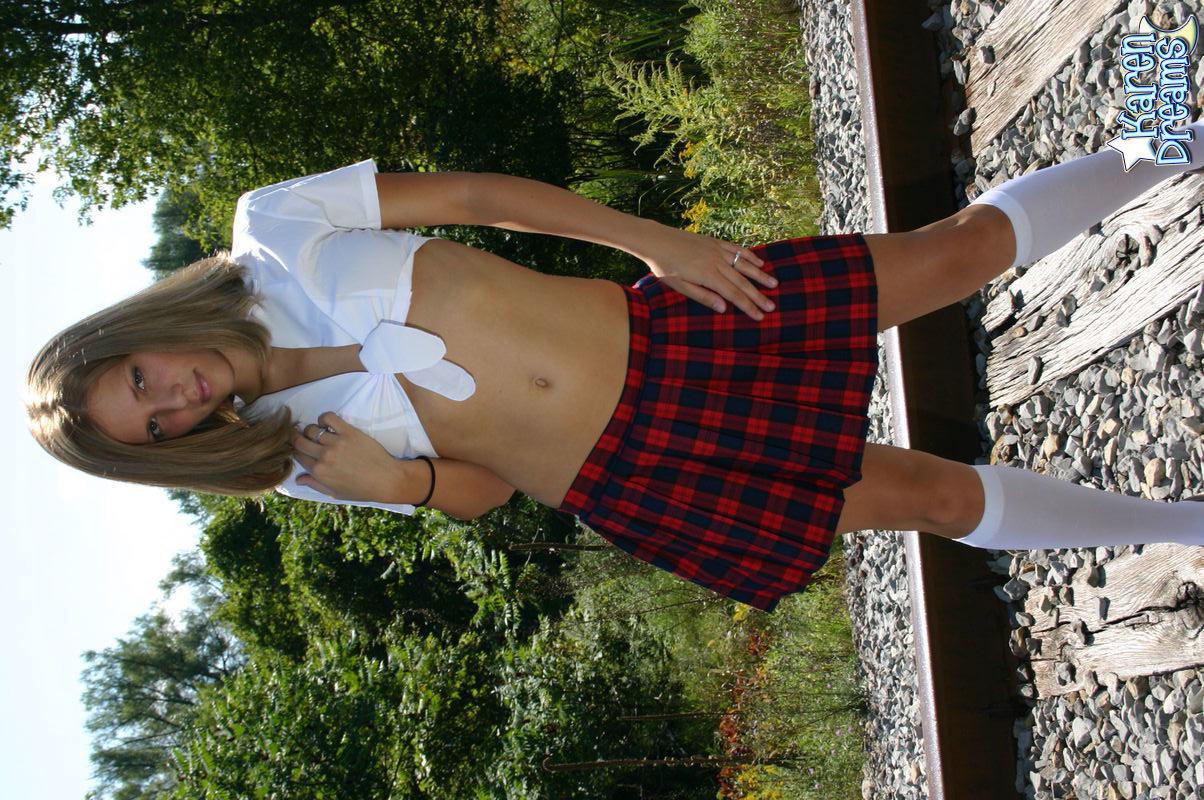 Pictures of Karen Dreams stripping out of her schoolgirl uniform #58012027