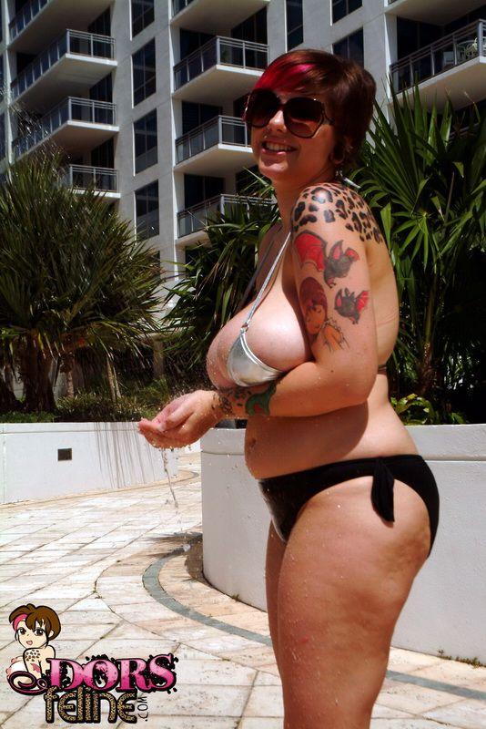 Pictures of Dors Feline trying to keep her massive jugs in a small bikini #54103167