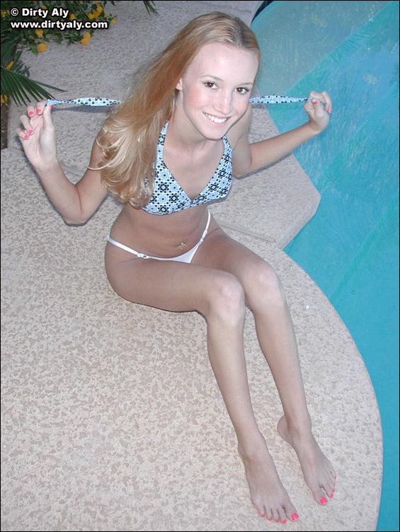 Pictures of teen Dirty Aly getting naked by the pool #54074294