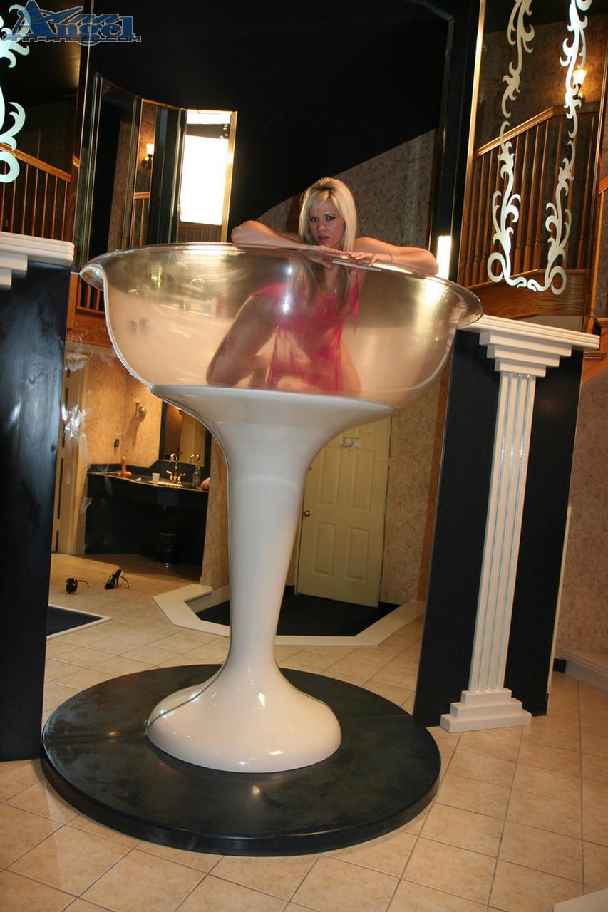 Pictures of hot teen Ann Angel serving herself in a champagne glass #53220770