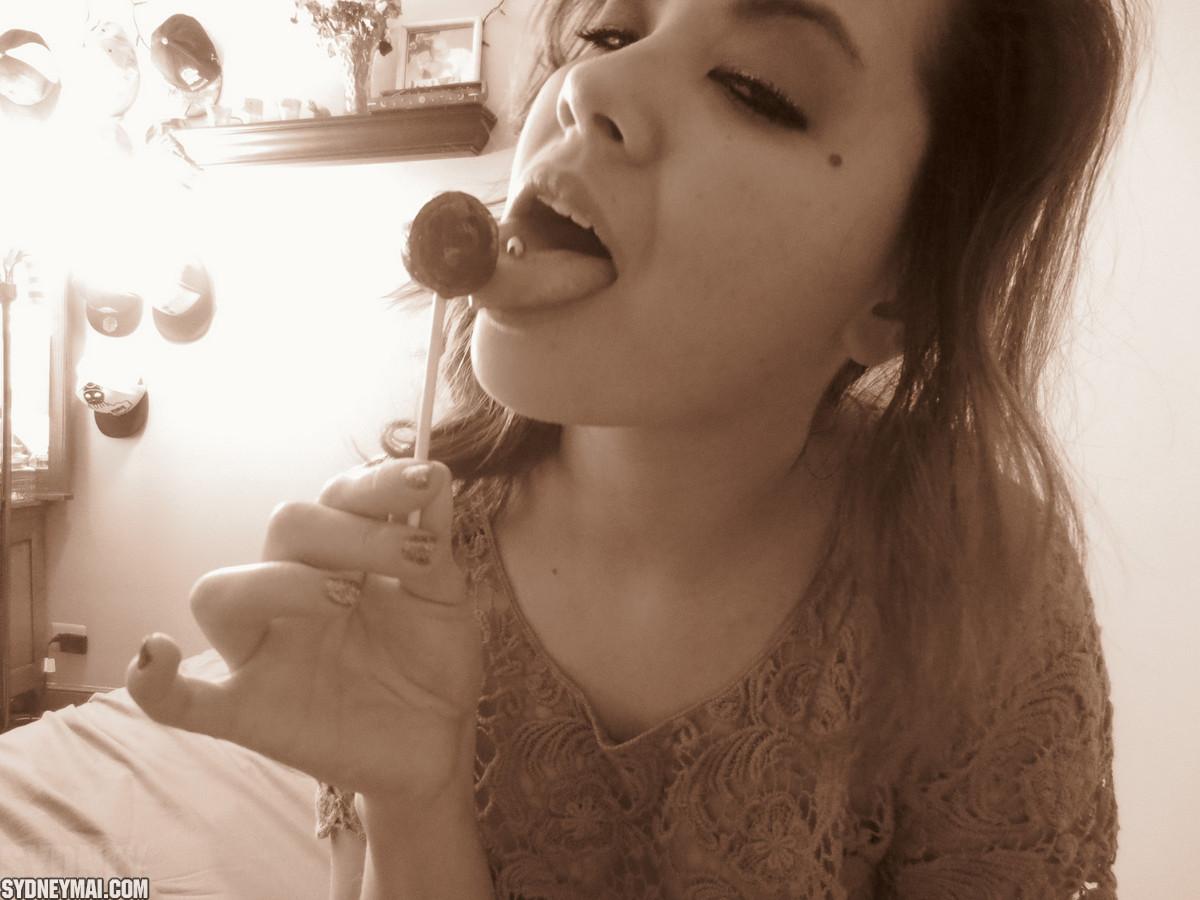 Beautiful asian girl Sydney Mai teaess with a lollipop #60041520