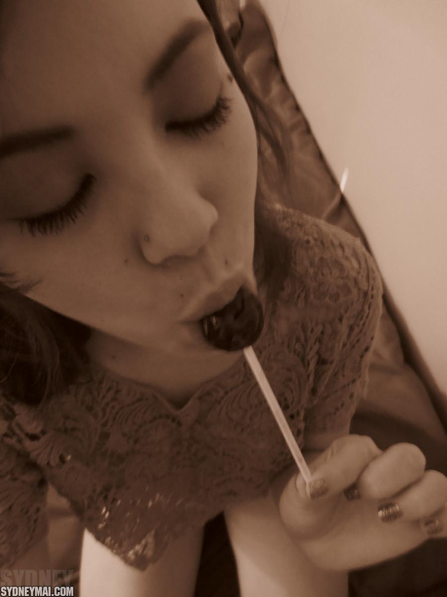 Beautiful asian girl Sydney Mai teaess with a lollipop #60041545