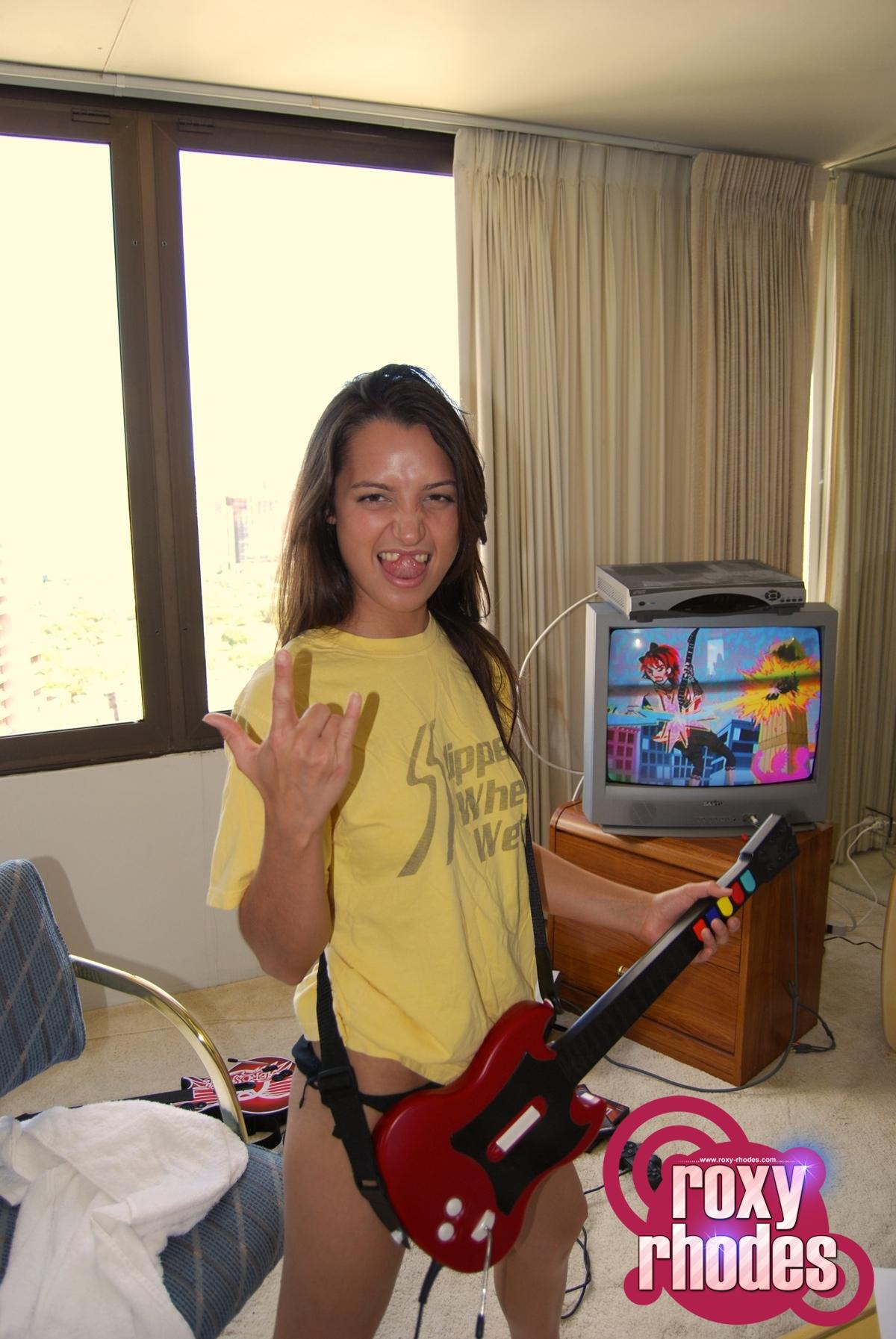 Pictures of teen girl Roxy Rhodes playing a sexy game of guitar hero #59880486