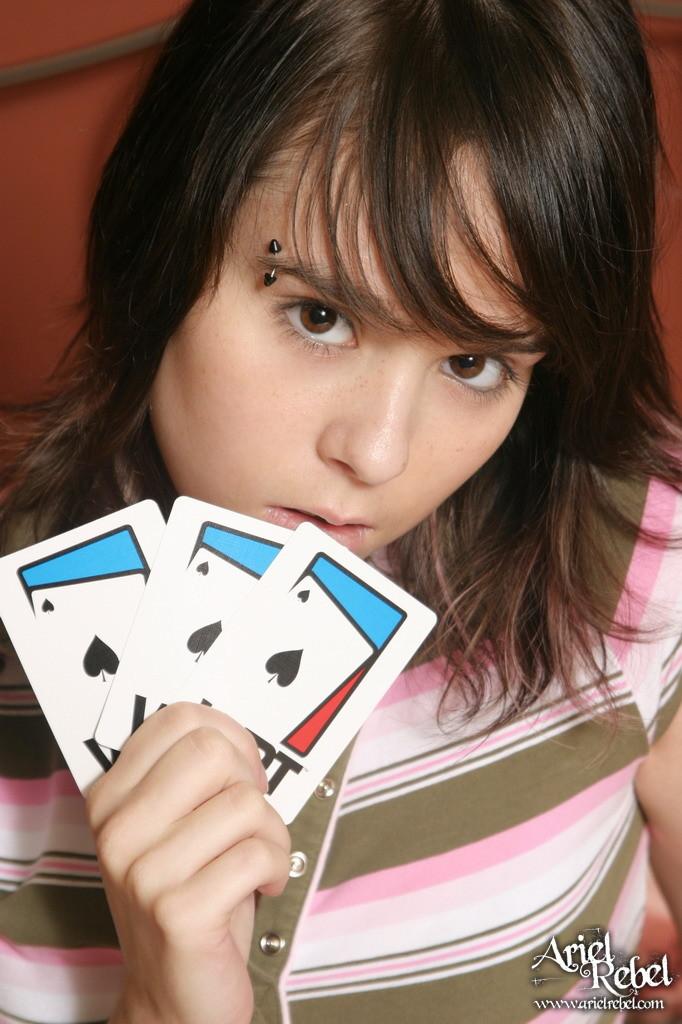 Pictures Of Teen Ariel Rebel Playing A Game Of Cards In Bed