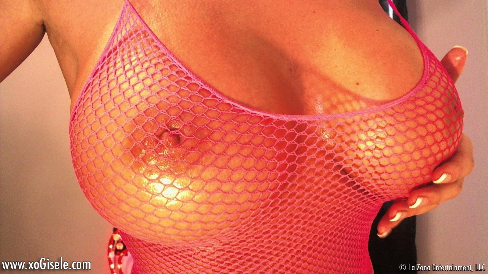 xoGisele rubs hot oil all over her hot body and takes off her tight fishnet bodysuit #59098975