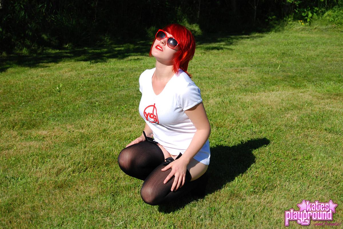 Redhead teen Sabrina teases as she dumps cold water all over her white shirt outdoors #60572744