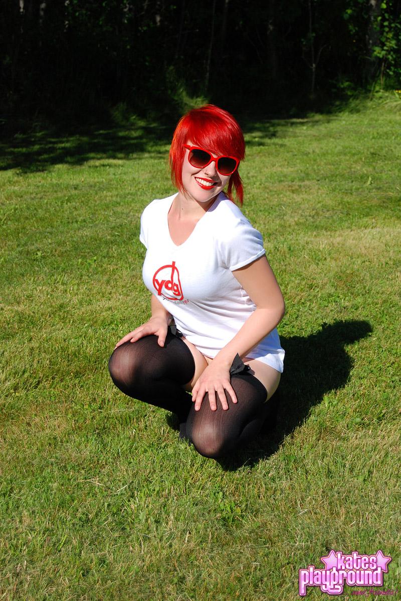 Redhead teen Sabrina teases as she dumps cold water all over her white shirt outdoors #60572756