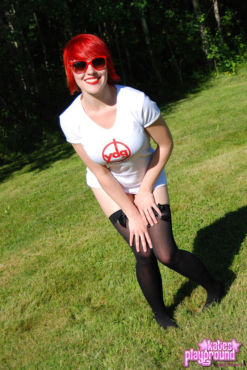 Redhead teen Sabrina teases as she dumps cold water all over her white shirt outdoors #60572779