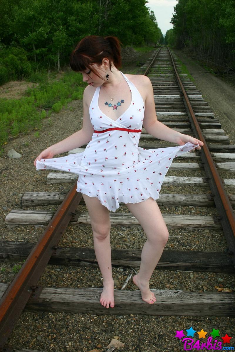 Barbie teases as she poses on the train tracks in a skimpy sundress #53414339