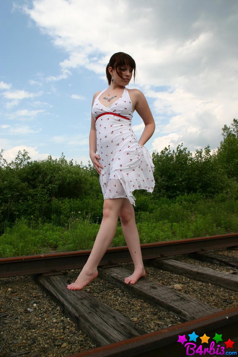 Barbie teases as she poses on the train tracks in a skimpy sundress #53414395