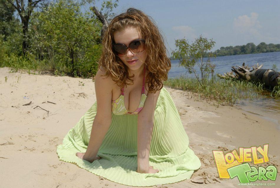 Teen girl stripping on the beach #59107725