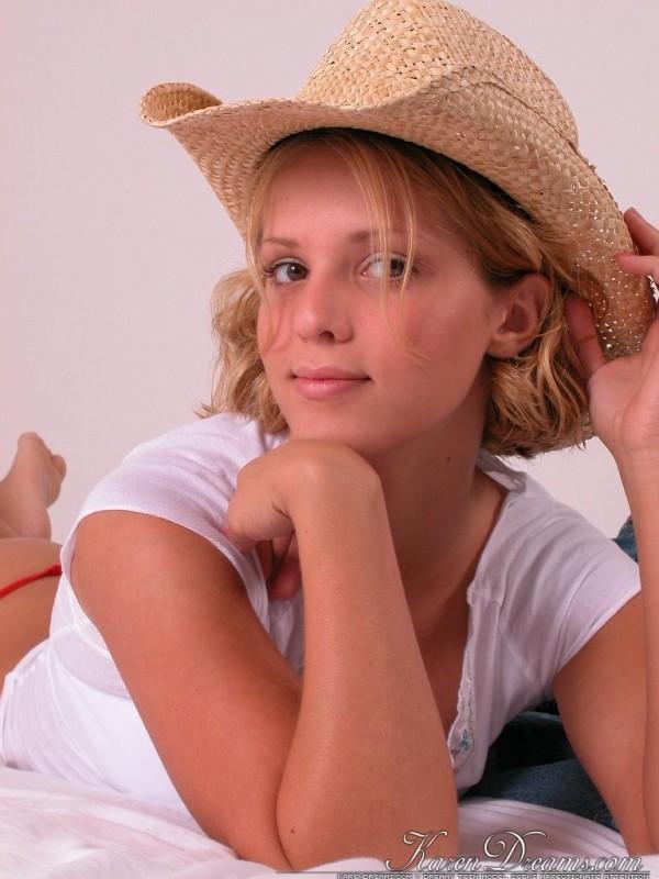 Karen in bed with a cowboy hat #58017073