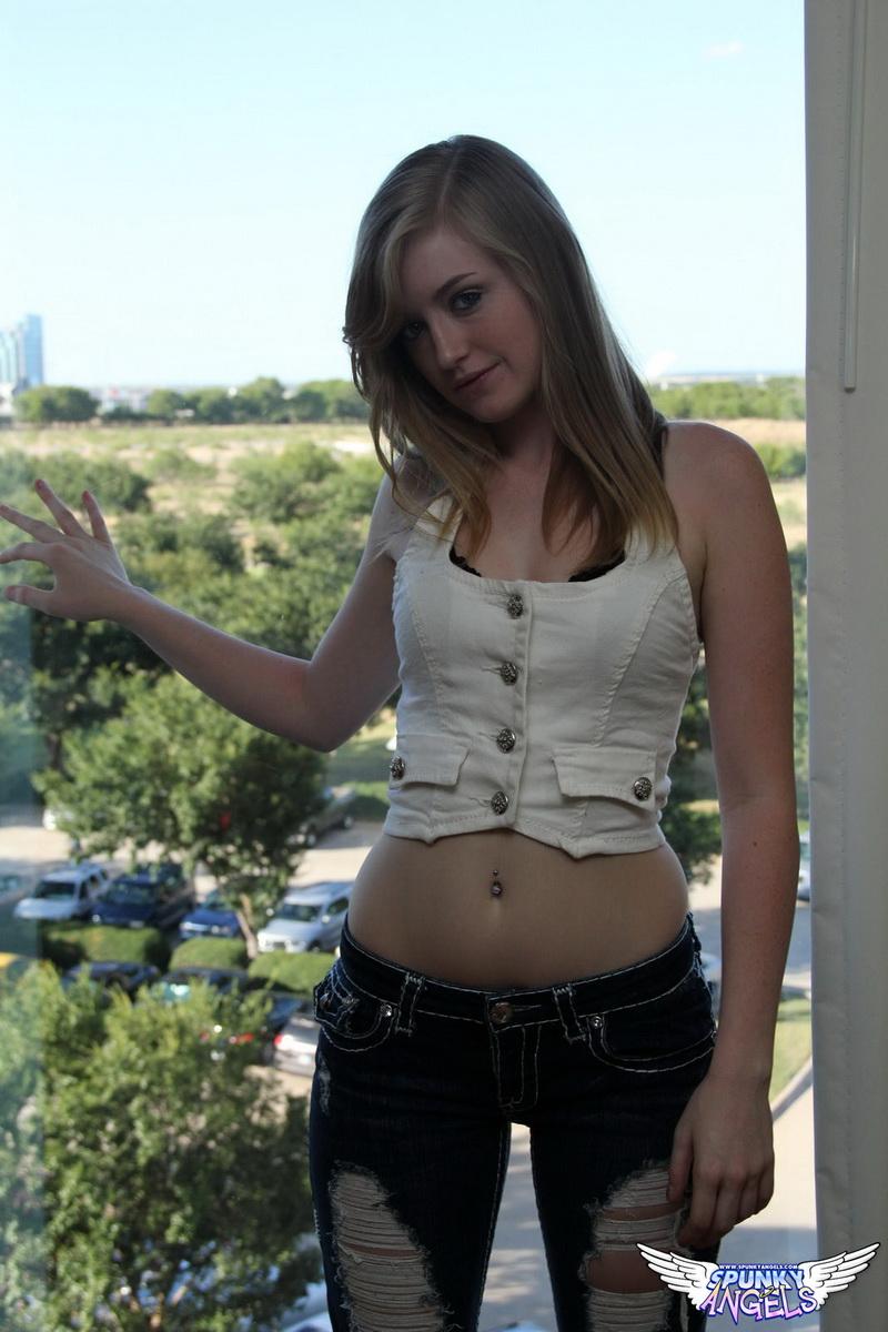 Mandy Roe gets topless in her tight ripped jeans before peeling them off in front of a big hotel window #59209333