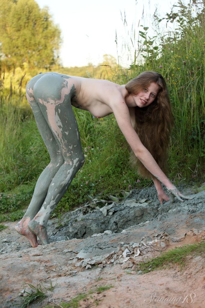 Pretty teen Nicole K rolls around in the mud outside #61931083
