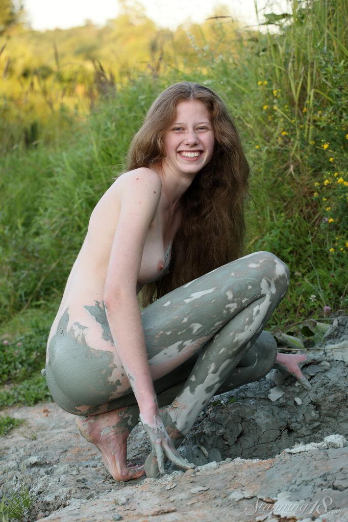 Pretty teen Nicole K rolls around in the mud outside #61931141