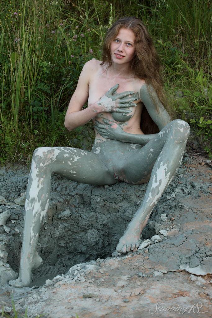Pretty teen Nicole K rolls around in the mud outside #61931174