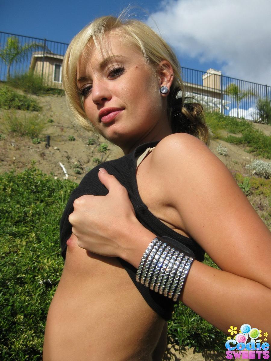 Horny teen Codie Sweets isnt shy as she strips naked outdoors in the backyard #58923002