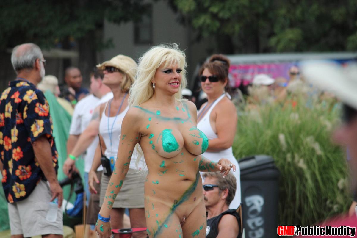 Hot strippers compete for awards at a outdoor public nudity festival #60506767