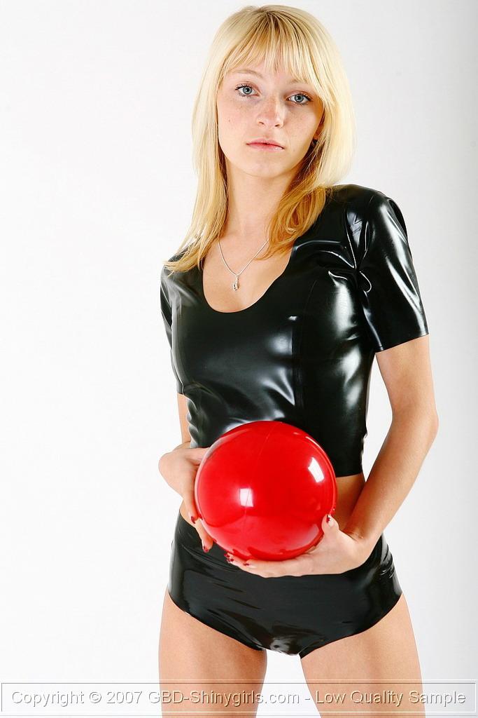 Pictures of a hot blonde shinygirl playing with a red ball #60470122